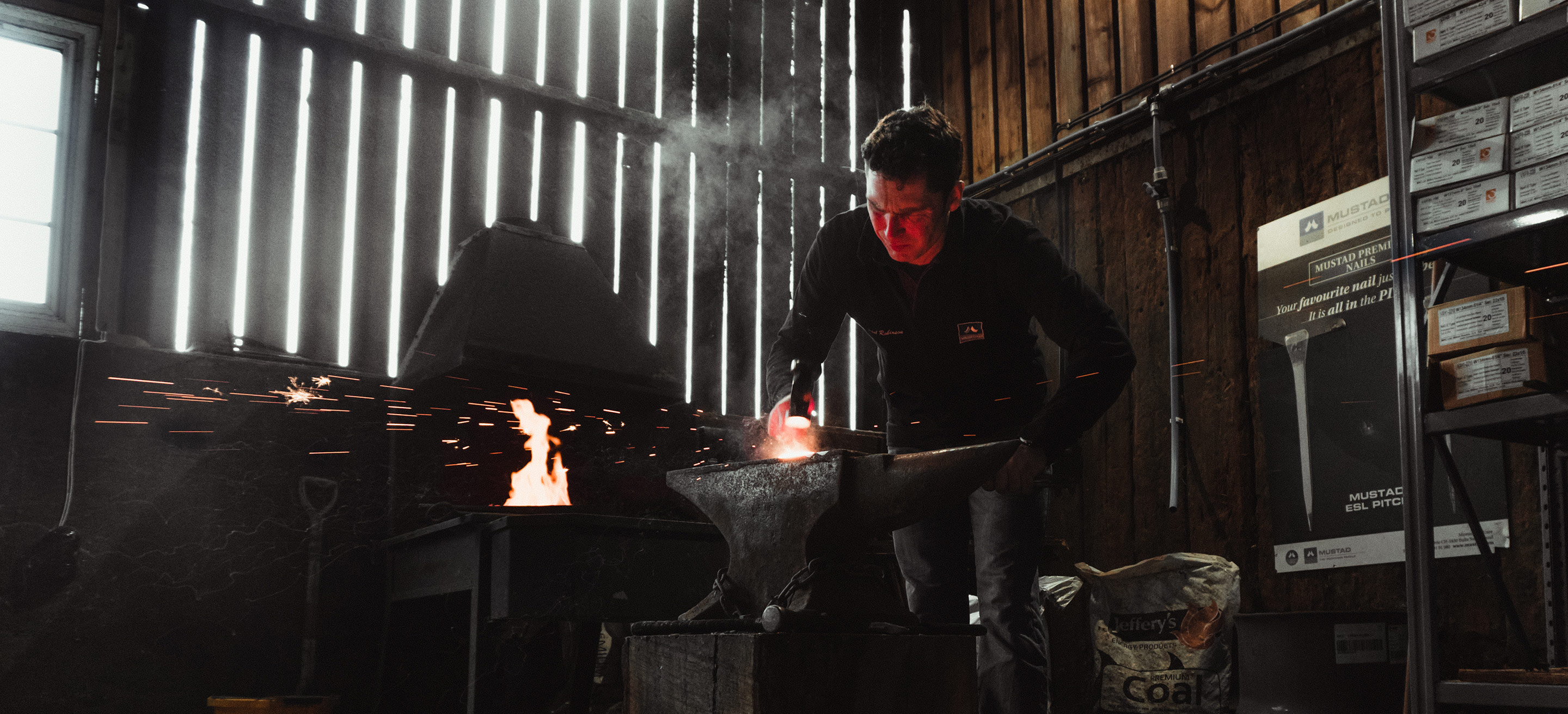 A farrier forging in his workshop