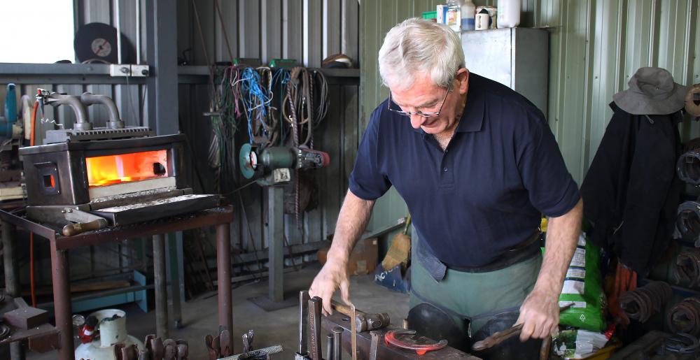 The Australian master farrier Carl O'Dwyer forging a horseshoe