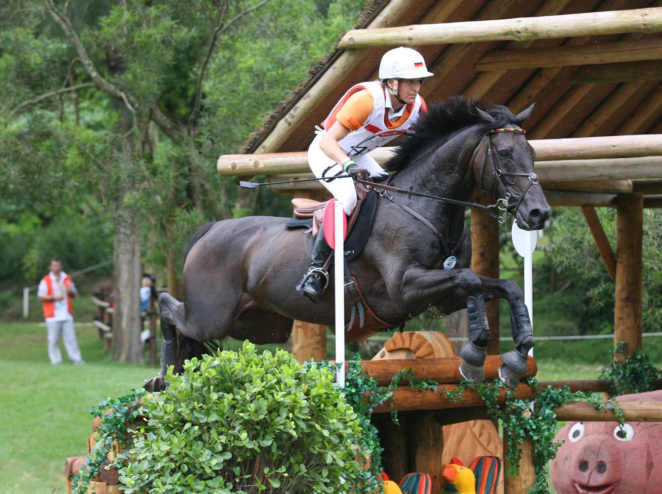 Ingrid Klimke jumps with her horse, Hong Kong 2012